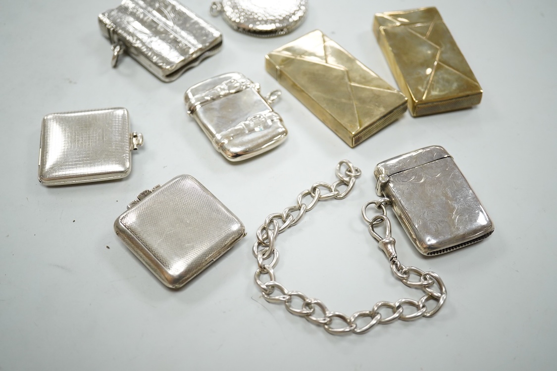 Three assorted silver vesta cases including one with a white metal chain, two gilded 900 standard white metal vesta cases, designed as a letter with postage stamp, 60mm, one 925 vesta case modelled as a satchel and two s